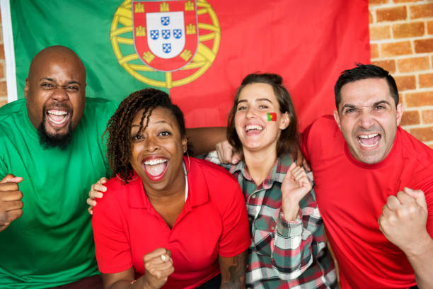 istock Friends cheering world cup with painted flag 979020220