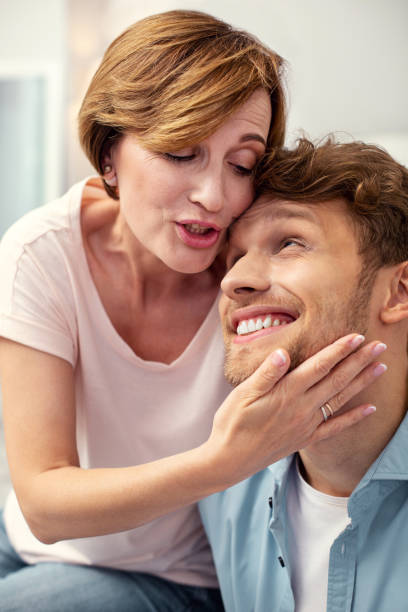 istock Pleasant mature woman caring about her son 979022150