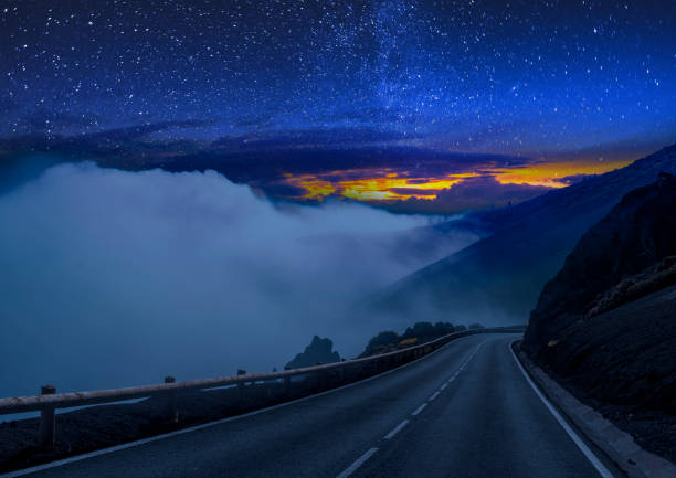 istock road through the desert under the volcano at night 979024422