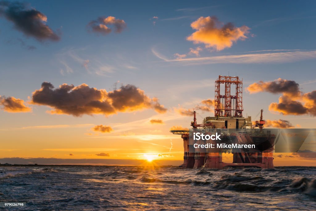 offshore oil rig at sunset Offshore Platform Stock Photo