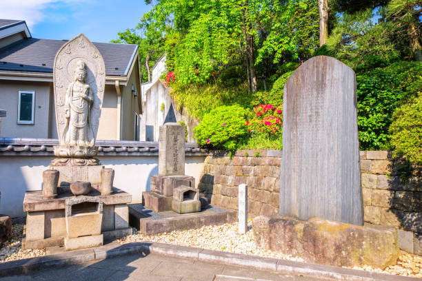 TOKYO, JAPAN - APRIL 20 2018: Tombs and religious statue at Sengakuji Temple TOKYO, JAPAN - APRIL 20 2018: Tombs and religious statue at Sengakuji Temple harakiri photos stock pictures, royalty-free photos & images