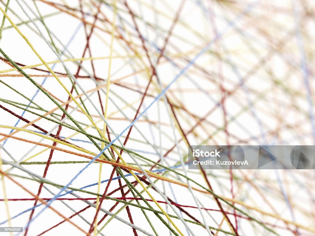 Pattern of multicolored, tightly strung, cotton threads Abstract photo of colored cotton threads on white background Thread - Sewing Item Stock Photo