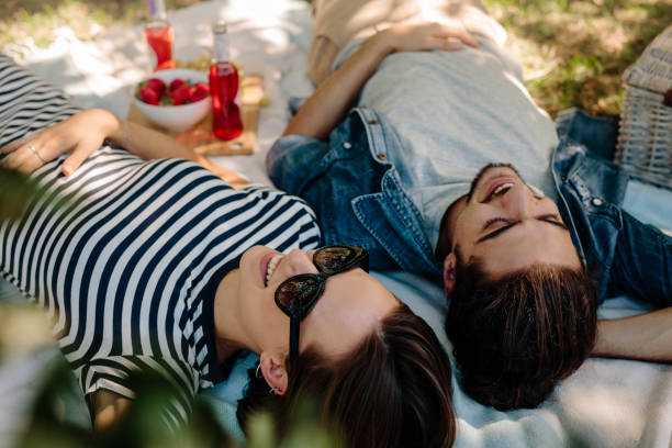 istock Cheerful couple on picnic at park 979031638