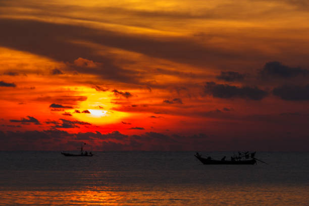 istock Sunset and fisherman 979036098