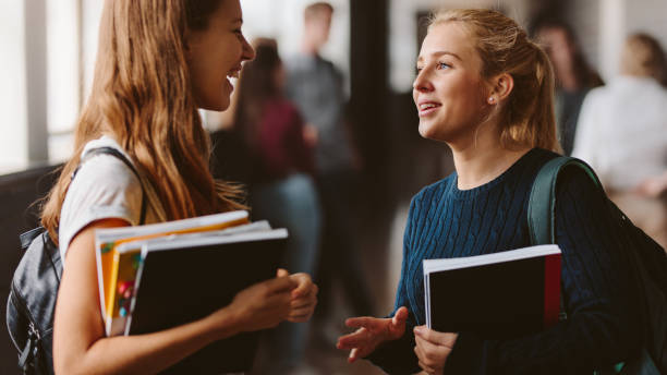 istock Girls chatting after the lecture 979036114
