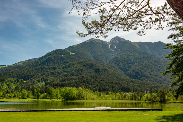 istock Mountain range seen from Lake Wildsee in the Austrian Alps 979036272