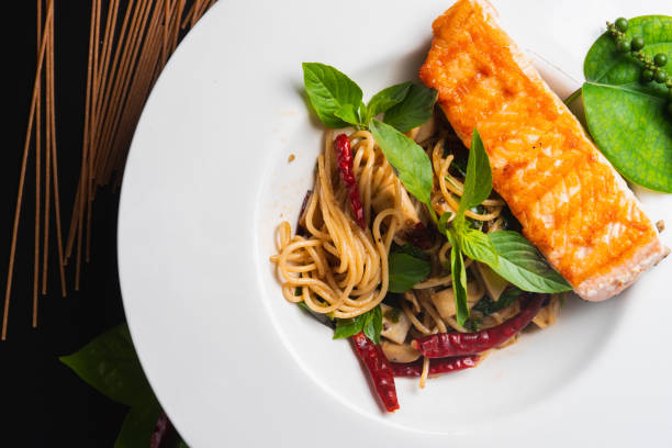 istock Pasta : Spaghetti with spicy salmon on the dish 979036280