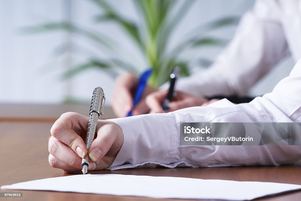 Writing girl Young businesswoman writing document in office Adult Stock Photo