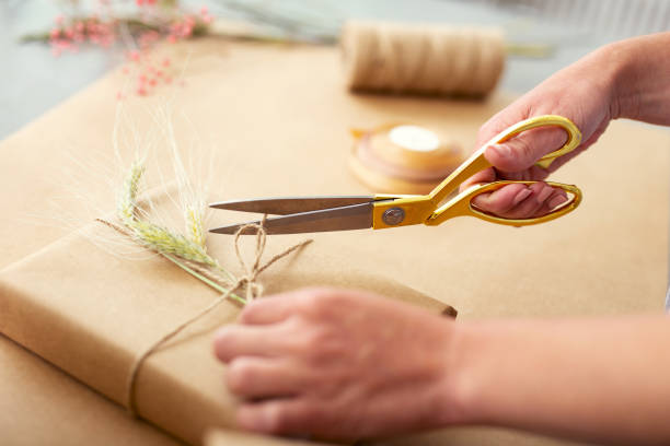 istock Close up of scissors cutting a rope 979039332
