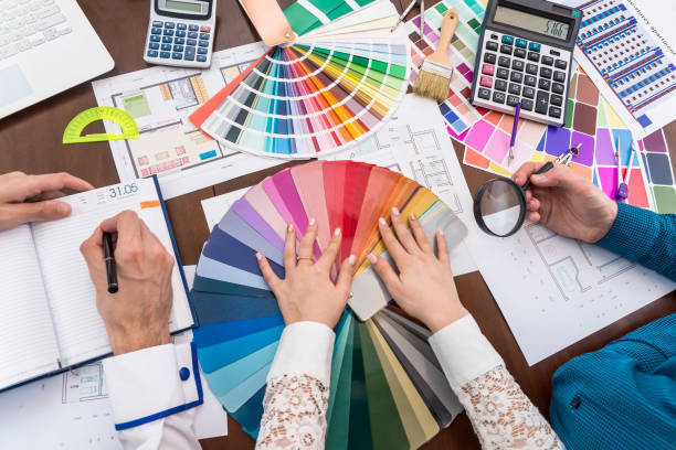 istock Top view of designer's workspace, discussing colour sampler 979039674