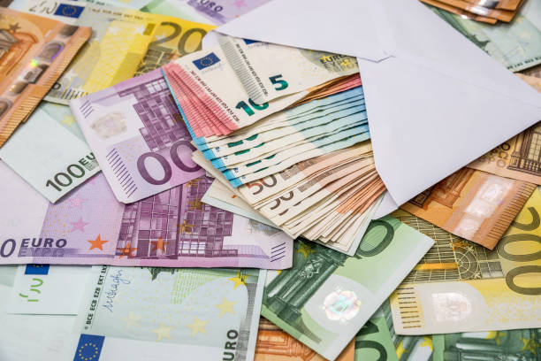 istock euro in white envelope on euro banknotes 979040464