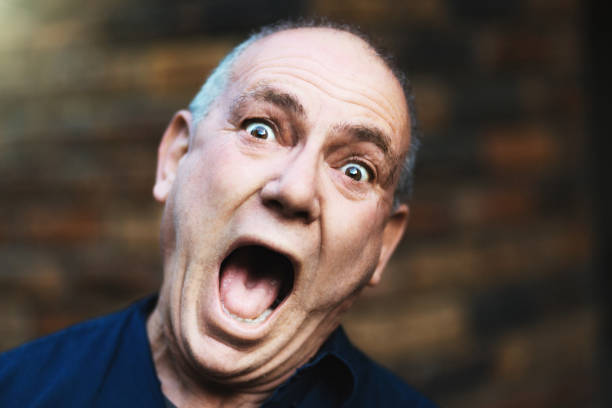 istock Senior man looks shocked or amazed 979066738