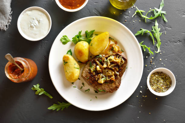 istock Beef steak with potato 979068386