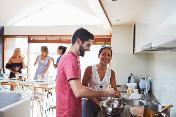 istock Social gathering friends cooking together. 979069196