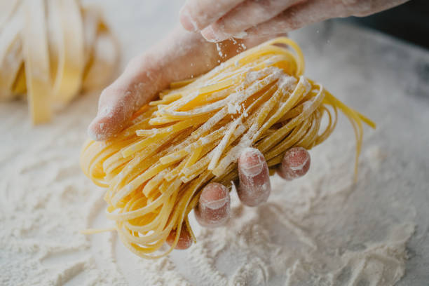 istock Chef making traditional italian homemade pasta 979074608