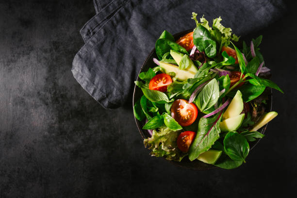 istock Detox tasty salad on dark table 979076172