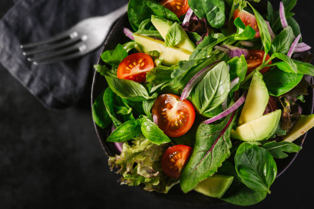 istock Detox tasty salad on dark table 979076544