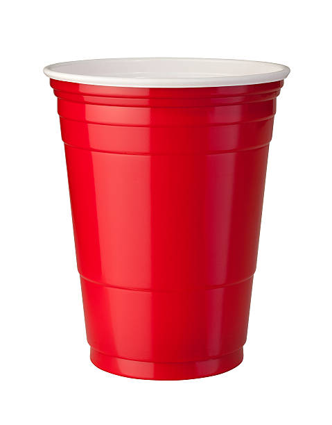 Red Plastic Cup (clipping path) Red plastic party cup shown with shiny reflective highlight. This container is popular at parties because it is strong and disposable. The image is isolated on a white background, and includes a clipping path. disposable cup stock pictures, royalty-free photos & images