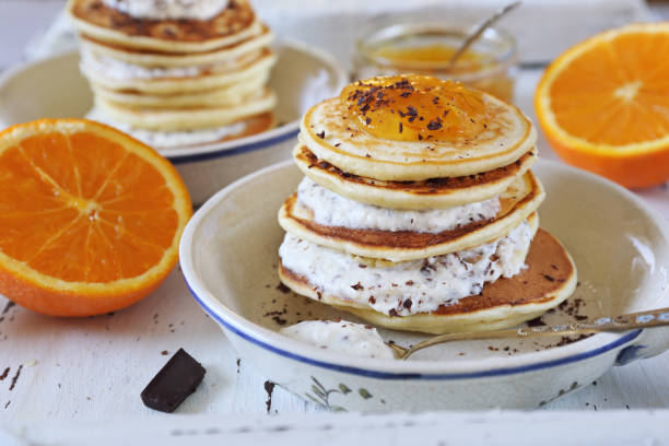 istock Ricotta pancakes with orange jam and chocolate, two portions 979081302