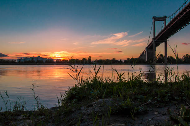 Sunset on the edge of a bridge.