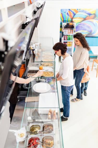 istock Group of people in bakery 979086756