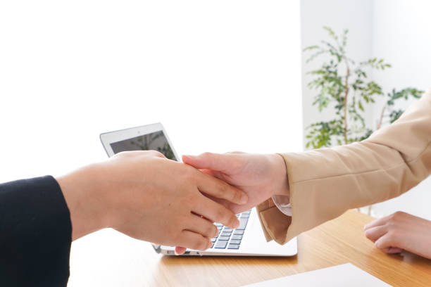 istock Business woman shaking hands 979103588