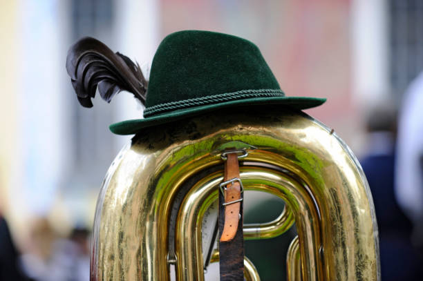 Italy, August 24 -- A trumpeter of a musical band of the Italian military corps of the Alpini troops during a parade. The banner bears the inscription of the Alpine troops Band of Sorisole, a little town near Bergamo, in northern Italy. Founded in 1872, the Alpini Corps are highly specialized mountain troops, famous for their decisive contribution in the First World War and currently active in many international peacekeeping scenarios. Image in high quality format.