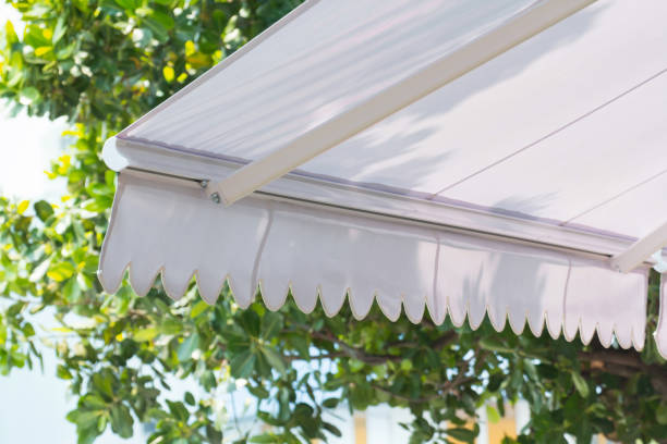 istock new white awning of coffee shop in garden background 979110344