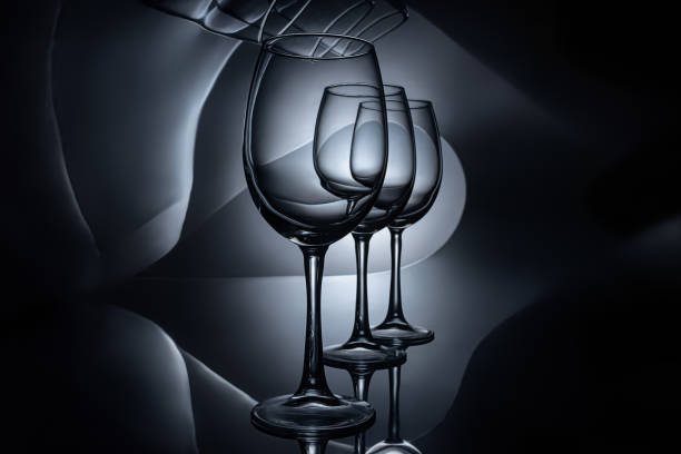 istock row on empty luxury wine glasses, dark studio shot 979111530