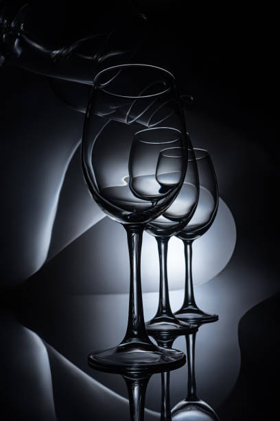 istock row on elegant wine glasses, dark studio shot 979112126
