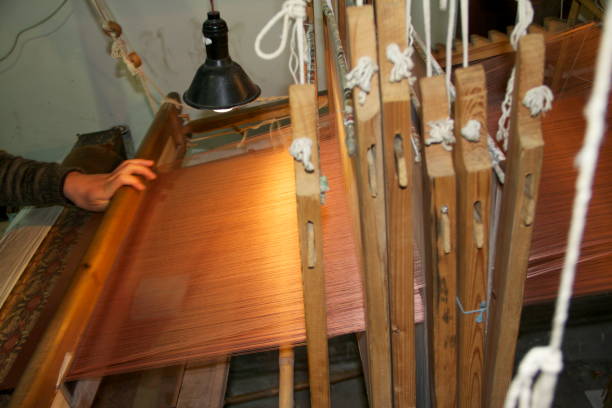 istock woven silk in a little factory 979114736
