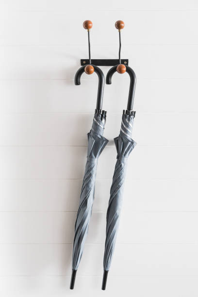 istock Close-Up Of Umbrellas Hanging On Wall 979114936