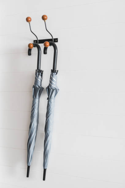 istock Close-Up Of Umbrellas Hanging On Wall 979114952