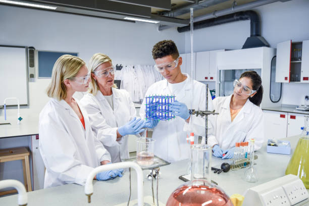 istock Science students in laboratory with female teacher 979116964
