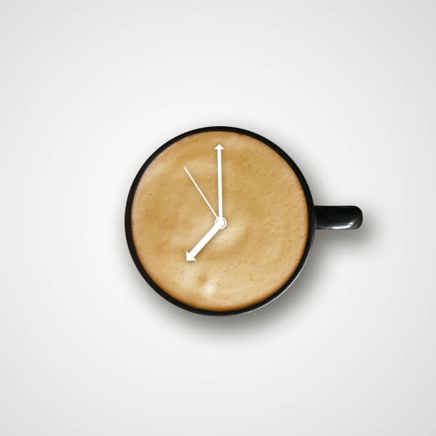 coffee in black mug with alarm clock sign