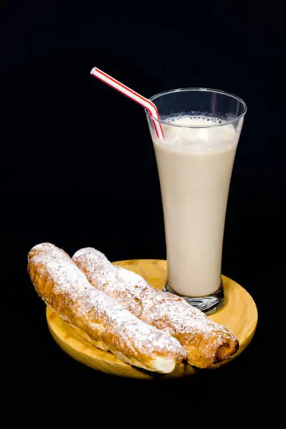 Horchata is a drink, made with the juice of tigernuts and sugar. Native from Valencia ? Spain, it is a refreshing drink, often accompanied with long thin buns called fartons.