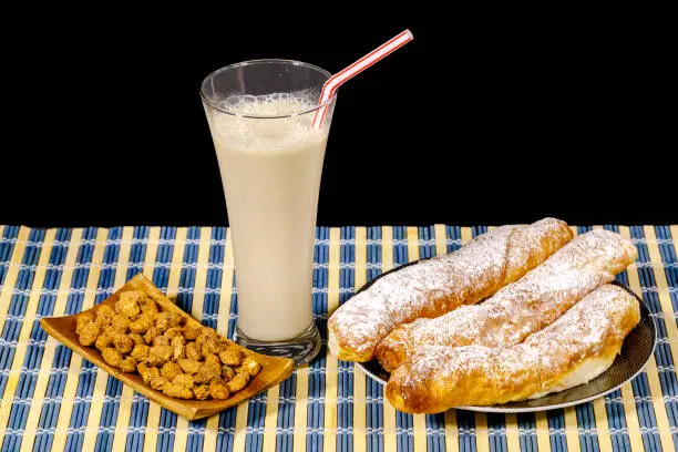 Horchata is a drink, made with the juice of tigernuts and sugar. Native from Valencia ? Spain, it is a refreshing drink, often accompanied with long thin buns called fartons.