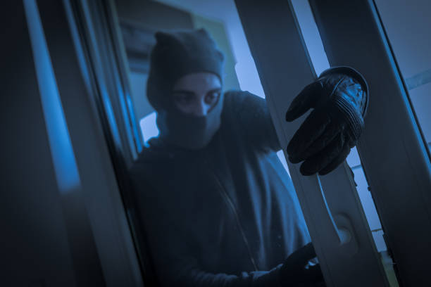 istock Burglar Breaking Into House 979130506