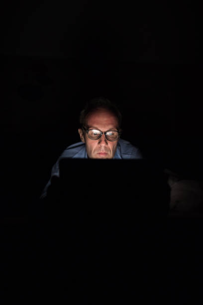 istock Mature Scandinavian man using digital tablet in dark room 979132678