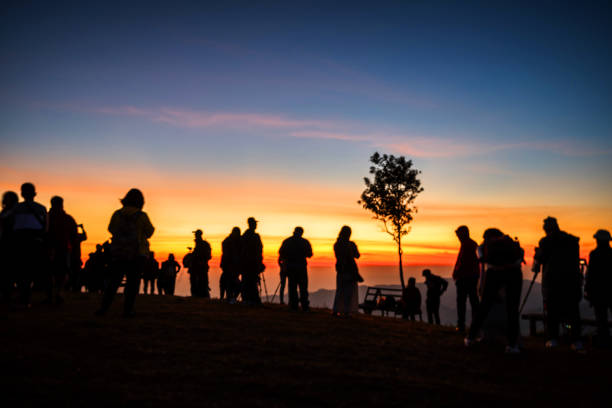 istock Silhouette People Standing Against Sky During Sunset 979134884