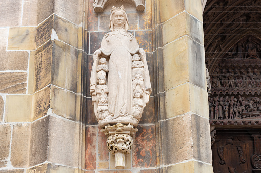 church stone art figures and columns on ancient facade in south german historical city