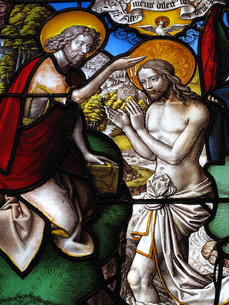 istock Baptism Of Christ On A Medieval Stained Glass Window 97914816