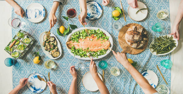 istock Family or friends having seafood summer dinner 979152718