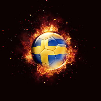 Sweden flag soccer ball with flames and fire isolated on black