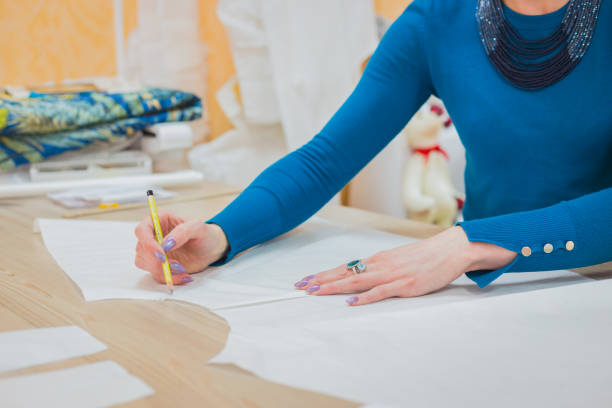 istock Fashion designer working with pattern of new couture collection 979173040