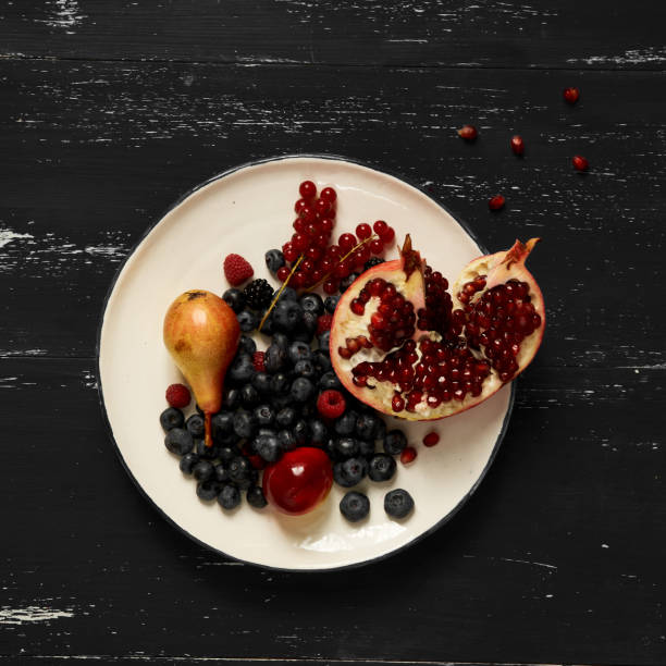 Fruits and berries lying on round plate