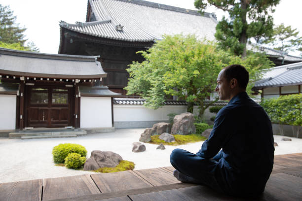istock Caucasian man looking at temple garden 979180108