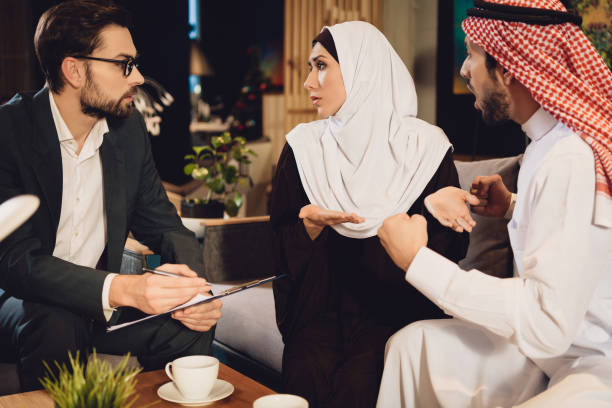 istock Arab couple at reception with a therapist arguing. 979184126
