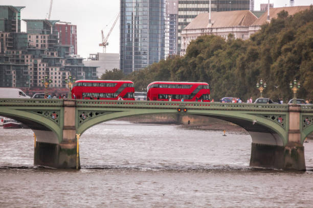 istock Red buses on Big Bens bridge in London, UK 979184450