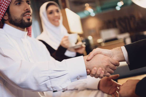 istock Arab businessman shakes hands with partner. 979188160